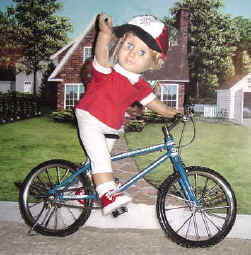Boy doll riding a bicycle