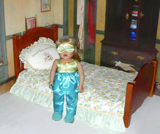 blue pajamas and valuable doll bed