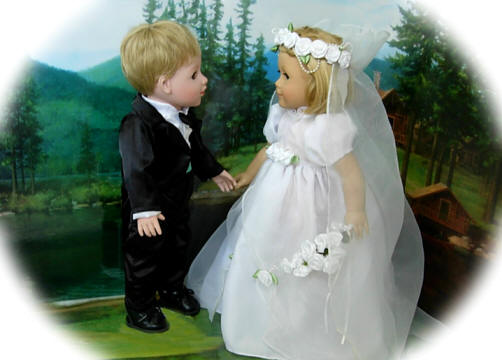 Boy doll in tuxedo set and 18 inch girl doll in a bridal gown